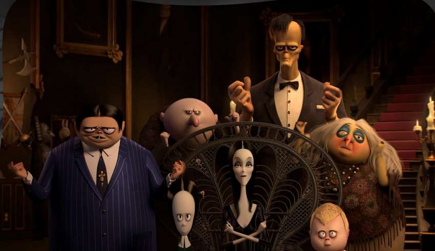 (L to R) Oscar Isaac as the voice of Gomez Addams, Chloë Grace Moretz as the voice of Wednesday Addams, Nick Kroll as the voice of Uncle Fester, Charlize Theron as the voice of Morticia Addams, Conrad Vernon as the voice of Lurch, Finn Wolfhard as the voice of Pugsley Addams, and Bette Midler as the voice of Grandma in Columbia Pictures' THE ADDAMS FAMILY